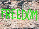 Freedom Word On The Wall Stock Photo