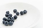 Fresh Blueberries On A White Plate Stock Photo