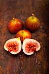 Fresh Figs Over Old Wood Stock Photo