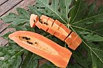 Fresh Papaya Slice On Green  Leave Background,still Life Stock Photo