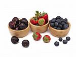 Fresh Summer Fruits, Cherry, Strawberry, And Blueberry In Wooden Stock Photo