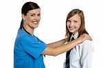 Friendly Female Doctor With Her Patient Stock Photo