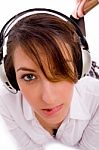 Front View Of Female Listening Music In Headset Stock Photo