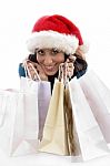 Front View Of Happy Christmas Woman With Shopping Bags Stock Photo