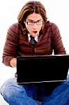 Front View Of Shocked Man Looking At Laptop Stock Photo