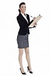 Full Length Of Business Woman Writing In Pad Stock Photo