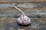Garlic On The Wooden Background Stock Photo
