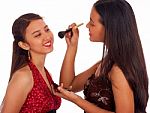 Girl Applying Makeup To Her Friend Stock Photo