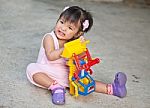 Girl Baby Playing Toy Stock Photo