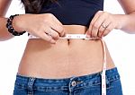 Girl Checking Her Waistline Stock Photo