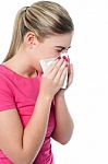 Girl Covering Her Nose With Handkerchief While Sneezing Stock Photo