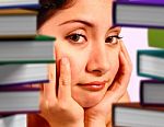 Girl Cupping Face With Stacked Book Stock Photo