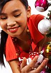 Girl Decorating Christmas Tree Stock Photo