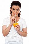 Girl Drinking Fresh Orange Juice Stock Photo
