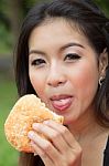 Girl Eating A Cheeseburger Stock Photo