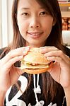 Girl Eating Cheese Burger Stock Photo