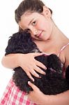 Girl Holding Dog Stock Photo
