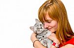 Girl Hugging Young Silver Tabby Cat Stock Photo