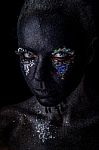 Girl In Black Makeup With Sparkles Stock Photo