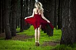 Girl Jumping In Forest Stock Photo