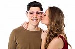 Girl Kissing Her Boyfriend Stock Photo