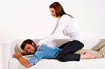Girl Massaging Her Husband Stock Photo