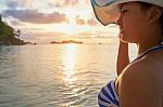 Girl On The Beach At Sunrise Stock Photo