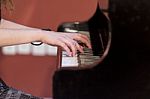Girl Plays Piano Stock Photo