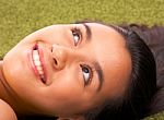 Girl Relaxing On Grass Stock Photo