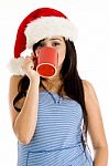 Girl With Christmas Hat And Taking Coffee Stock Photo