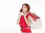 Girl With Gift Bags Speaks By Mobile Phone Stock Photo