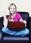 Girl With Laptop And Mug Stock Photo