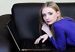 Girl With Laptop At Home Stock Photo
