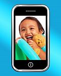 Girl With Toys On Mobile Phone Stock Photo