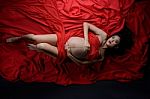 Glamour And Style Of Beautiful Young Asian Pregnant Woman Laying Stock Photo