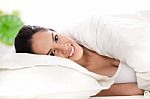 Glamour Woman On Bed Stock Photo