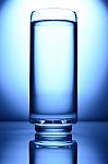 Glass Of Water Spot Light Blue Stock Photo