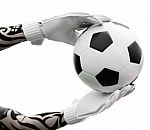 Goalkeeper's Hands Catching The Soccer Ball On White Background Stock Photo