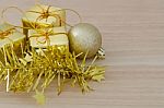 Gold Christmas Bauble And Three Present Boxes Stock Photo