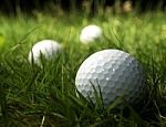 Golf Balls On Grass Stock Photo