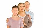 Granddaughter Grandmother Young Mother Standing On White Backgro Stock Photo