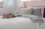Green Pillow On Kid's Bedroom With Brown Bag Stock Photo
