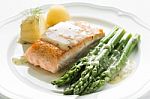Grilled Salmon With Boiled Potatoes And Asparagus On White Plate Stock Photo
