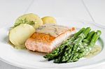 Grilled Salmon With Boiled Potatoes And Asparagus On White Plate Stock Photo