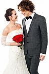 Groom And Bride Gazing At Each Other In Love Stock Photo