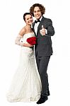 Groom With His Bride Showing Thumbs Up Sign Stock Photo