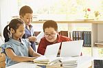 Group Of Asian Kids Using Laptop Computer Stock Photo