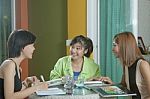 Group Of Asian Woman Friends Talking About New Project With Happ Stock Photo