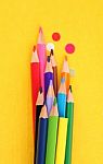 Group Of Pencils On A Yellow Background Stock Photo