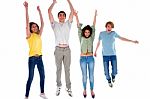 Group Of Teenagers Jumping Stock Photo